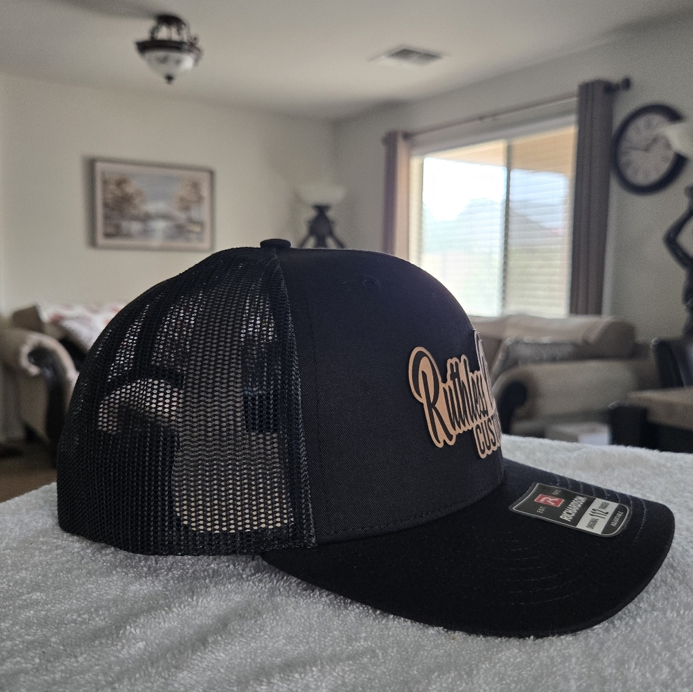 RUTHLESS OUTLAWZ CUSTOMS  LEATHER PATCH  CAP.      (6 PANEL  TRUCKER CAP)